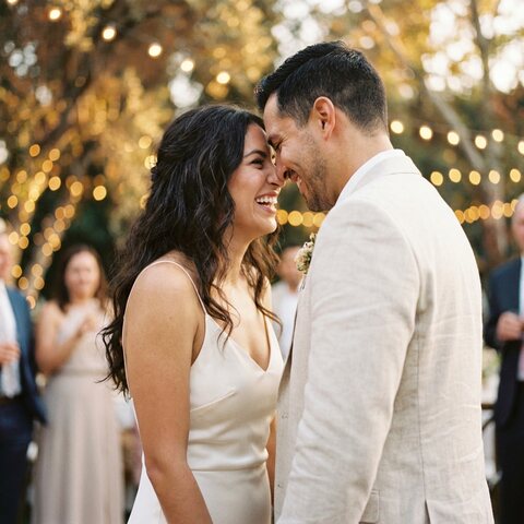 Inés and Tomás laughing at their wedding